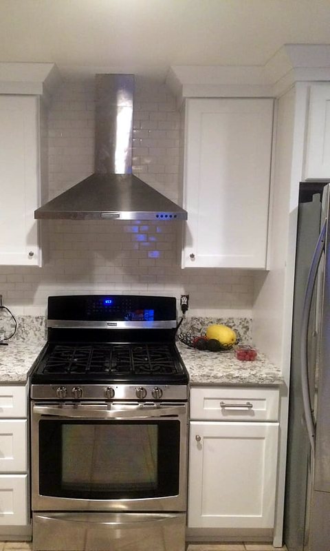Range and wall-mount vent hood installation
